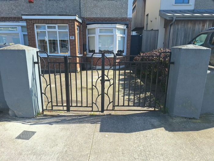 Black wrought iron mdtal double garden gates
