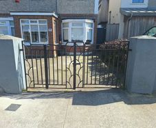 Black wrought iron mdtal double garden gates