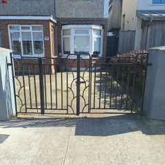 Black wrought iron mdtal double garden gates