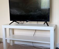 TV with Roku and Console Table