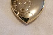 the variety club child's face brooch.