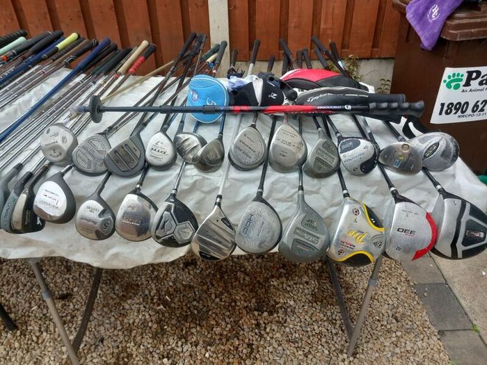A selection of golf clubs and bags. NOT SELLING SEPARATE