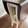 Cream and walnut-effect gateleg drop leaf table Image 4