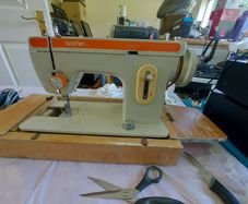 Brother Sewing Machine Model E, 671, With Pedal-Power Supply, Accessories, in reasonable condition, Box Cover & Base wood has major wear, but actually machine seems fine
