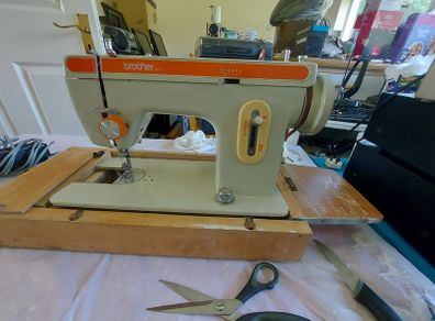Brother Sewing Machine Model E, 671, With Pedal-Power Supply, Accessories, in reasonable condition, Box Cover & Base wood has major wear, but actually machine seems fine