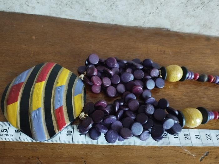 Vintage spectacular necklace made of wooden beads and medallion.