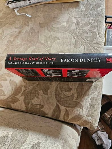 A Strange Kind Of Glory. Sir Matt Busby & Manchester United.  By Eamon Dunphy. First Edition Hardback With Dustjacket In Good Condition.  See Photos For Same.