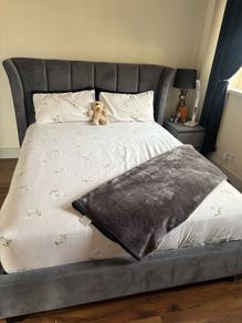 Kingsize grey velvet bed frame with matching curtains