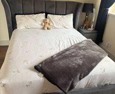 Kingsize grey velvet bed frame with matching curtains