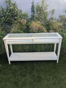 IKEA console table with glass top.