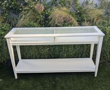 IKEA console table with glass top.