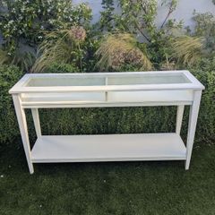 IKEA console table with glass top.