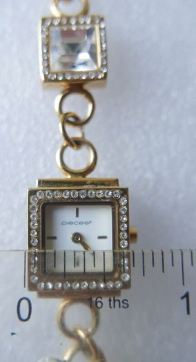 Pieces gold tone bracelet watch with crystal detail