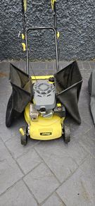 Self propelled petrol lawnmower with 2 grass boxes and manual