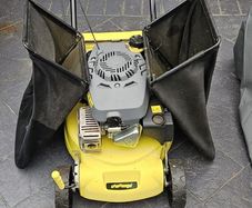Self propelled petrol lawnmower with 2 grass boxes and manual