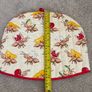 quilted cotton tea cosy featuring a playful ant and picnic food print Image 4