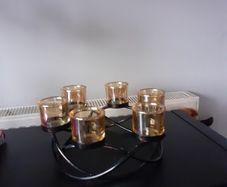 Round wrough iron with 6  thick  glasses for csndles or tea light candles 15 euro         glassas