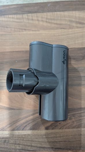 Dyson V6 handheld vacuum cleaner with charger and accessories