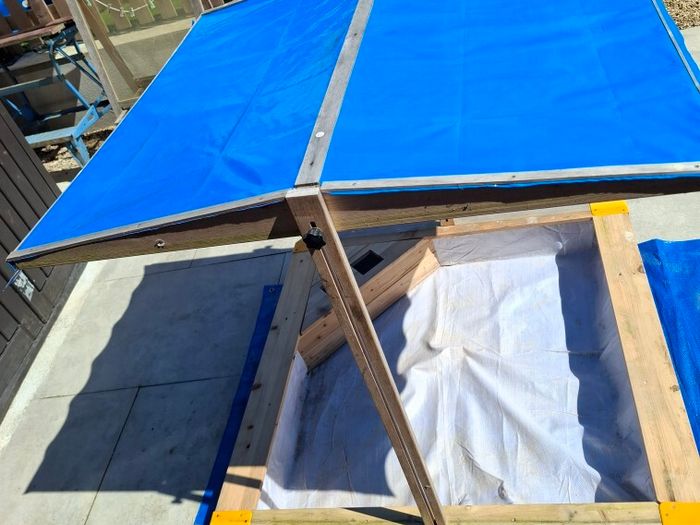 sand pit with canopy roof