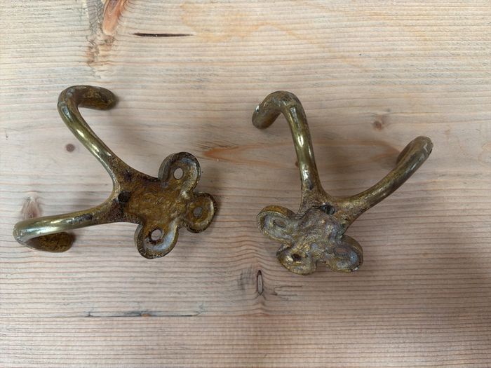 Two brass hooks