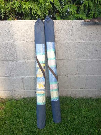 Pair of windbreaks with blue carry covers