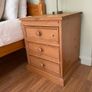 Solid antique pine three-drawer bedside locker Image 2