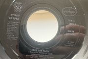 Bon Jovi. Keep The Faith. Seven inch jukebox large hole single. Etched label and backed with I wish every day could be like Christmas. Plays great. No cover.