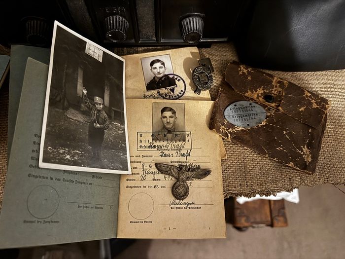 WW2 German documents with an eagle pin and an identification tag for one soldier