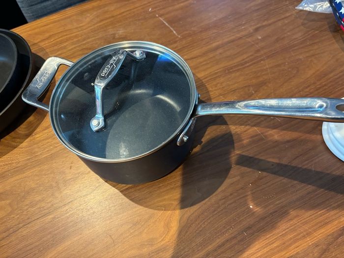 Set of All Clad pots and pans