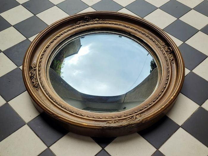 Antique gilt wood floral motif convex mirror