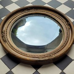 Antique gilt wood floral motif convex mirror