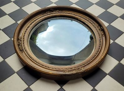 Antique gilt wood floral motif convex mirror