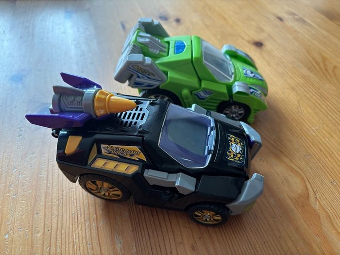 Two V-Tech Switch & Go Dinos