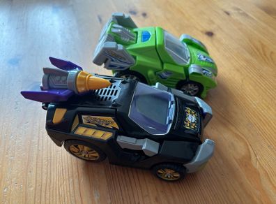Two V-Tech Switch & Go Dinos