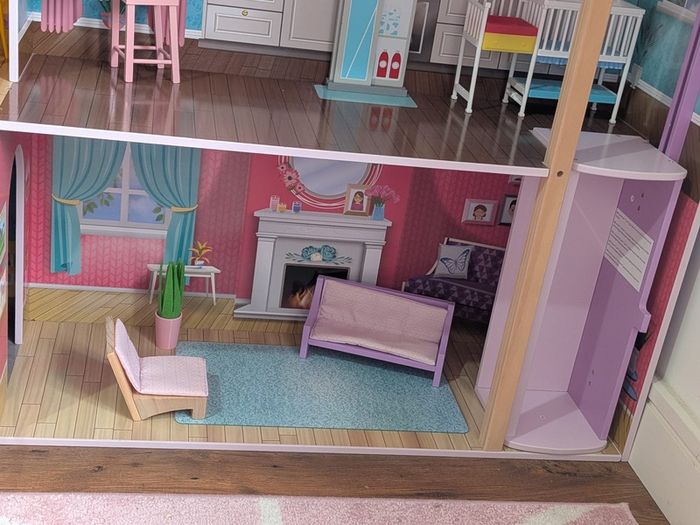 Large wooden dolls house with furniture