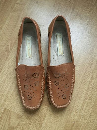 Beige coloured.