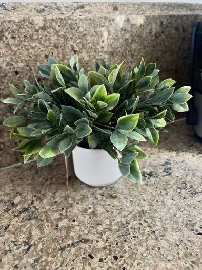 artificial plant in white pot home decor