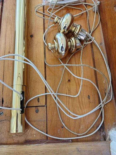 Brass coloured curtain track