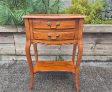 vintage French Provincial or Louis XV-style wooden bedside table/side chest featuring two drawers, cabriole legs, and a lower open shelf