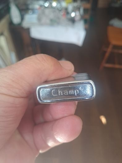 Champ Flip top petrol lighter.