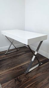 Modern white desk with chrome cross legs