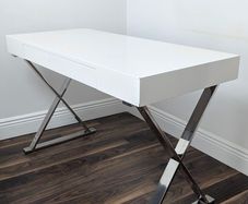 Modern white desk with chrome cross legs