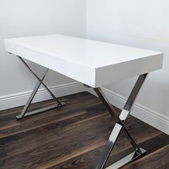 Modern white desk with chrome cross legs