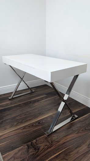 Modern white desk with chrome cross legs