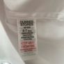 3 dunnes white shirts (new/as new) age 6-7 Image 5