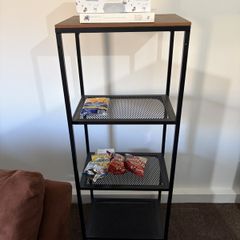 Walnut and black metal shelving unit