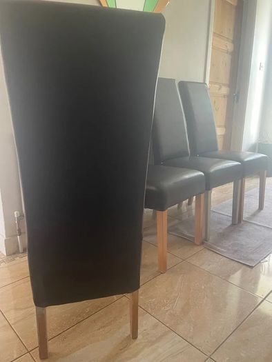 4 dark brown dining room chairs & 4 stretch covers