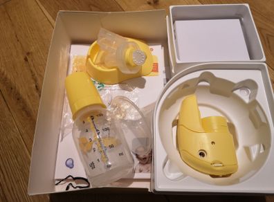 Medela mini electric breast pump, storage bags and Colostrum collection