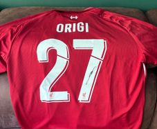 Origi signed Liverpool jersey