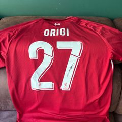 Origi signed Liverpool jersey